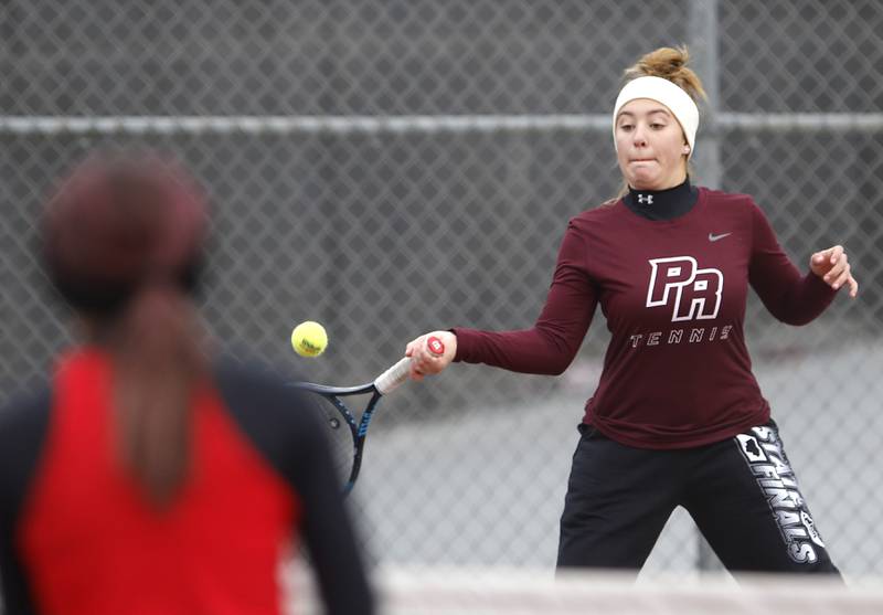 Prairie Ridge’s Aleena Ciezak returns the ball Thursday, Oct. 20, 2022, during during the first day of the IHSA State Girls Tennis Tournament at Schaumburg High School in Schaumburg.