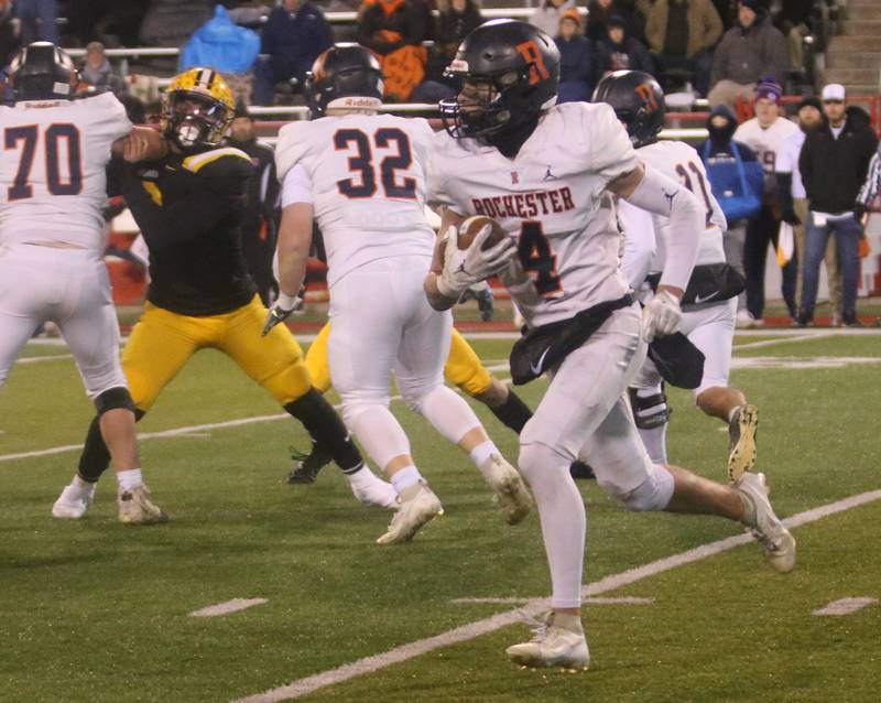 Rochester's Jack Buecker runs the ball against St. Laurence during the Class 4A State football championship on Friday, Nov, 24, 2023 at Hancock Stadium in Normal.