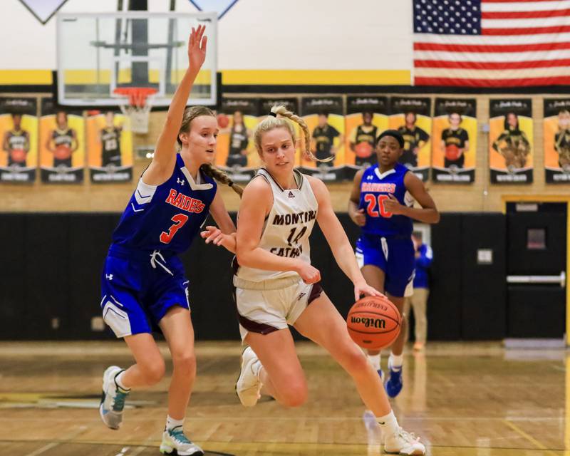 Montini Catholic's Shannon Blacher (14) makes a move towards the basket during Class 3A Hinsdale South Regional final game between Glenbard South at Montini Catholic.  Feb 17, 2023.