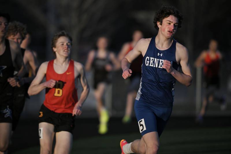 Geneva’s Cameron Lotspeich leads a pack of runners in the 1,600-meter run at the Les Hodge Boys Track and Field Invitational at Batavia High School on Friday, April 5, 2024.