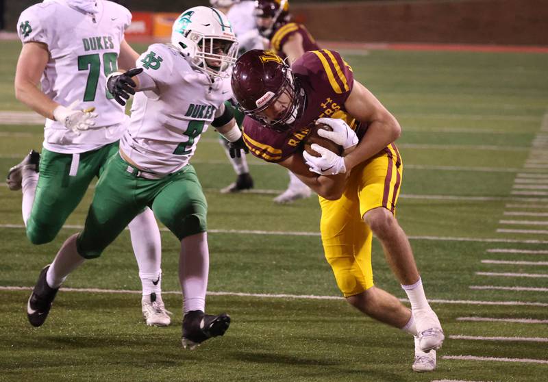 Loyola Academy's Drew MacPherson is tackled by York’s Angelo Martire as he scores a touchdown during their Class 8A state championship game Saturday, Nov. 30, 2024, in Hancock Stadium at Illinois State University in Normal.