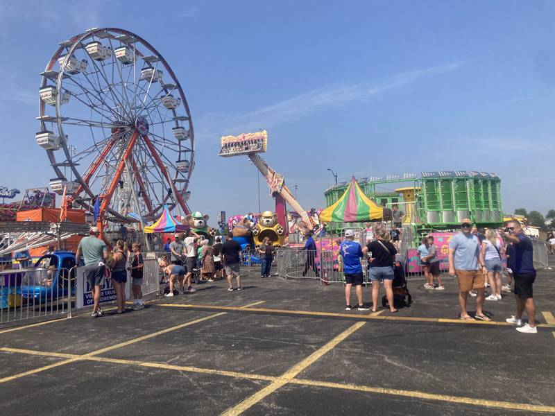 Guests mingle at the Shorewood Crossroads Festival carnival on Saturday, August 2, 2025.