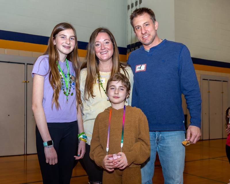 Gwen Cola, center with her cousin Laney, (L).  Mom, Hilary and Dad, A.J. at the St Baldricks Foundation event for at Forest Road Elementary School in La Grange Park. March 23, 2023.