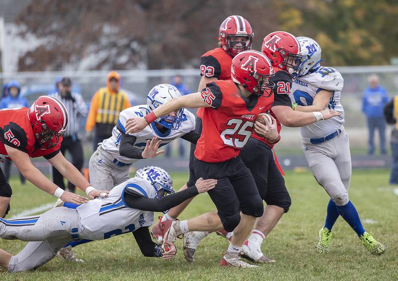 Amboy’s Brayden Klein runs the ball up the middle against Martinsville Saturday, Nov. 9, 2024, for round two of the 8-man football playoffs.