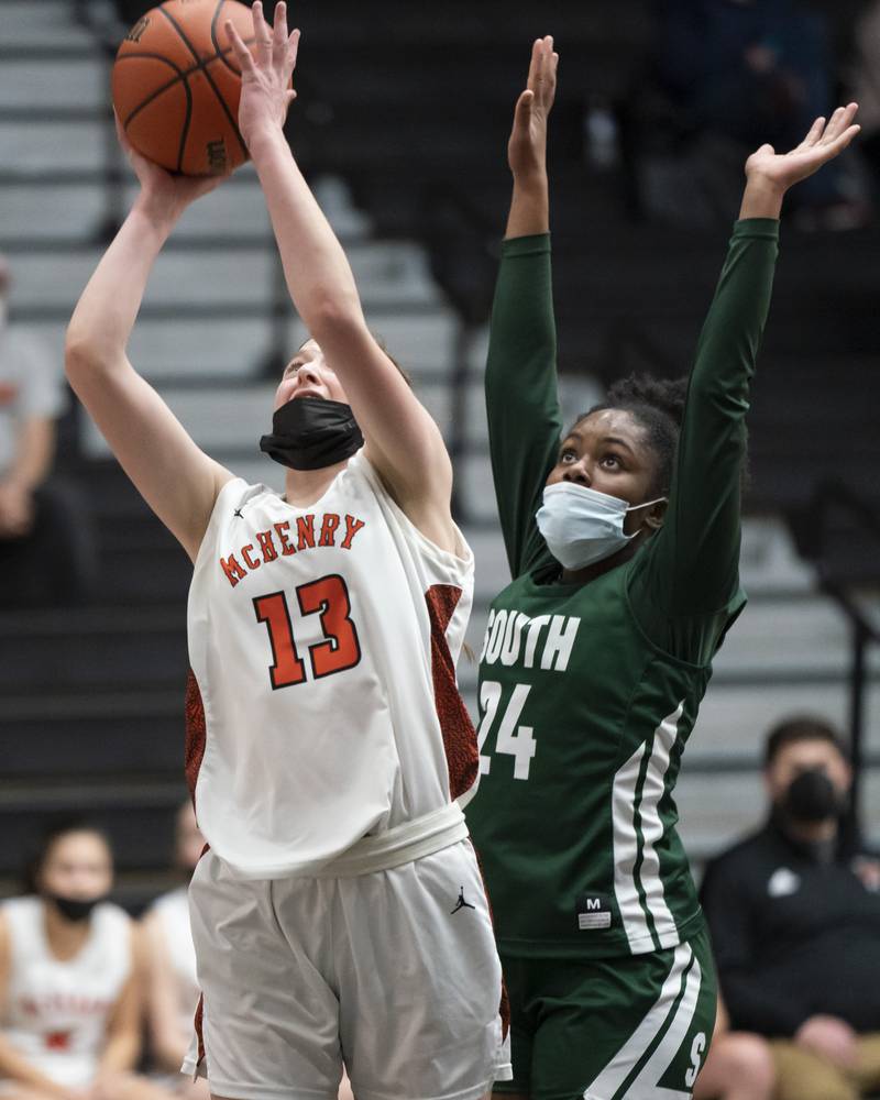 McHenry's Alyssa Franklin shoots as Crystal Lake South's Kree Nunnally defends during their game on Tuesday, January 11, 2022 in McHenry.