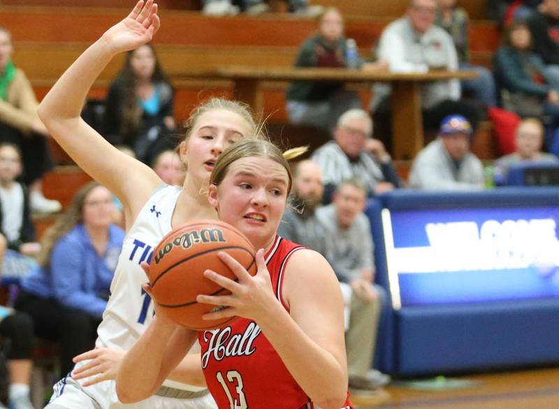Hall's Caroline Morris looks to pass as Princeton's Payton Brandt defends during the Princeton Holiday Girls Basketball Tournament on Friday, Nov. 23, 2024 at Princeton High School.