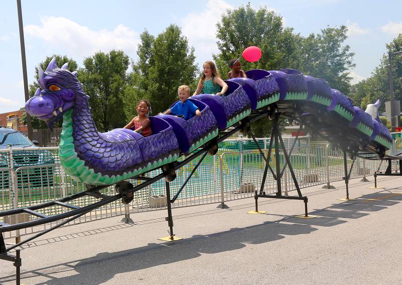 Kids ride the dragon rollercoaster at the Windmill City Festival in Batavia on Saturday, July 13, 2024 in Batavia.