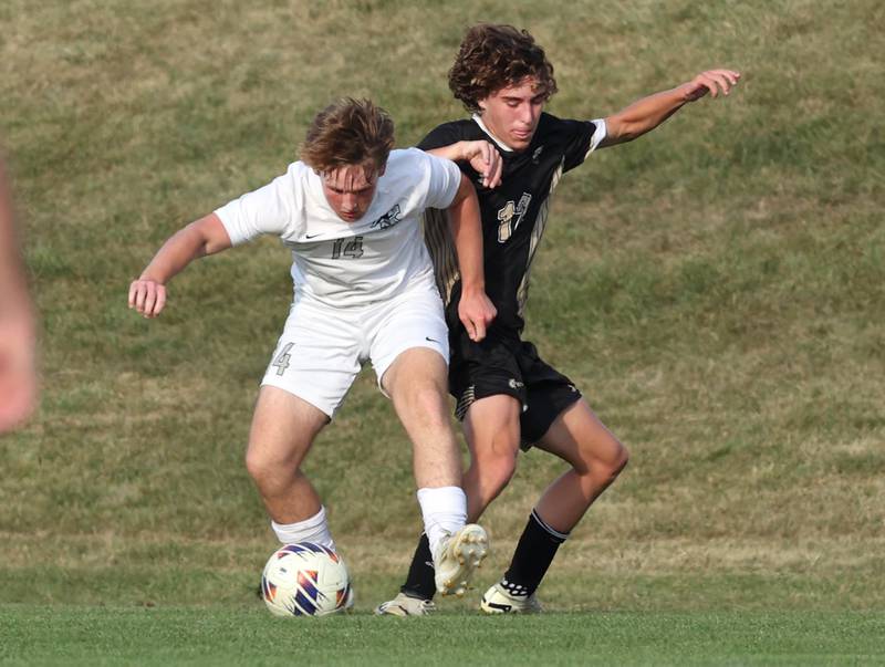 Kaneland's Nathan Scarpelli (left) and Sycamore's Maddux McLaughlin fight for possession during their game Wednesday, Sept. 18, 2024, at Sycamore High School.
