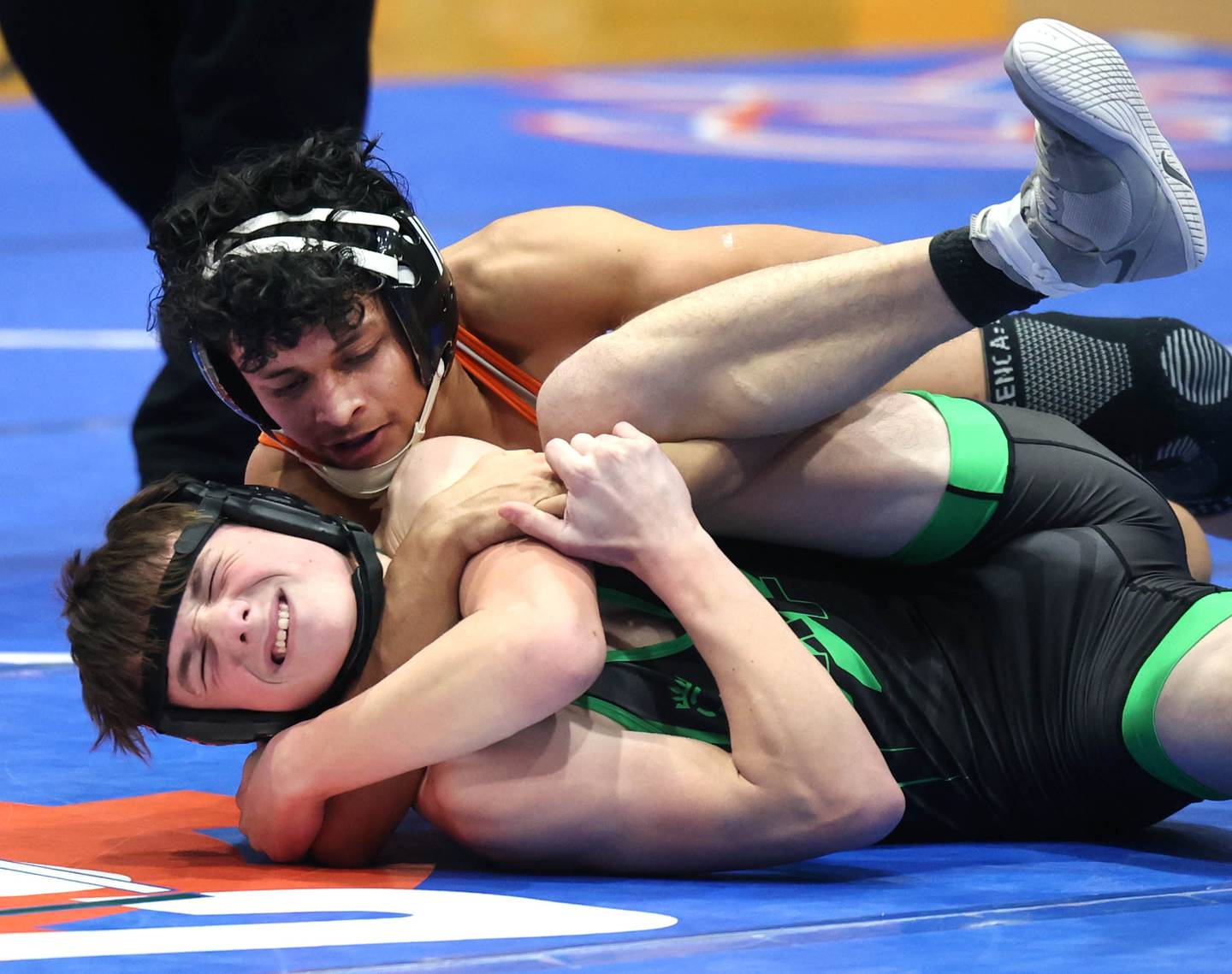 Genoa-Kingston's Chris Rodas tries to turn  Rock Falls’ Elliott Yacklich tries to get position against Thursday, Jan. 16, 2025, during their 157 pound match at Genoa-Kingston High School.