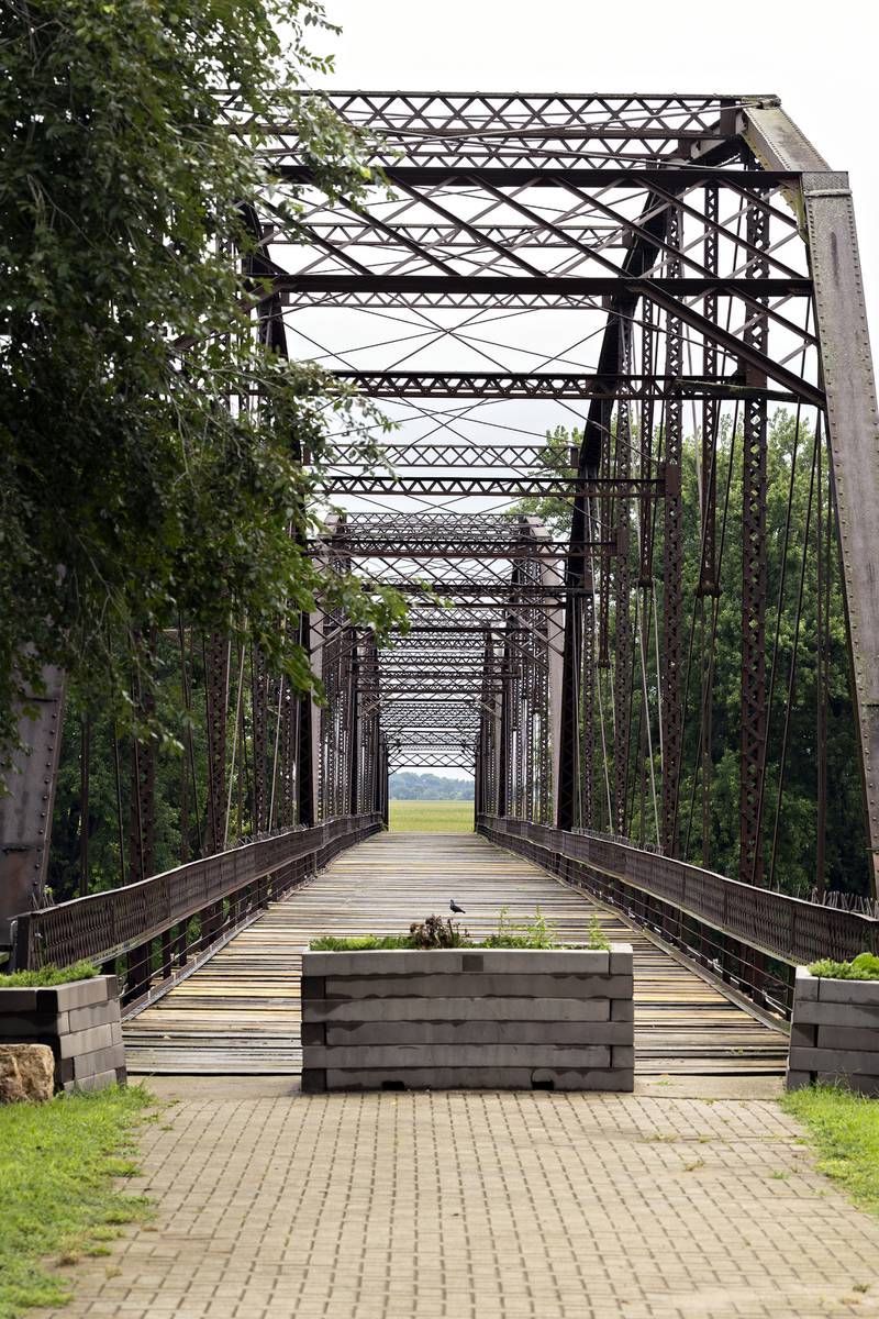 The historic Lyndon bridge is seen Thursday, July 30, 2025, spanning the Rock River. Closed in 1980, the village continues to sell plank repairs for a $100 donation with a name plate being dedicated to the donor.