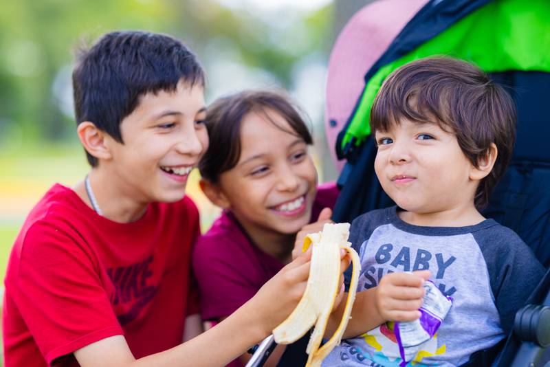 Children have lunch at one of the Northern Illinois Food Bank's free summer lumch programs. The food bank, based in Geneva, provides 56 sites where free lunches are served to children who would otherwise have free breakfast or lunch while school is in session.