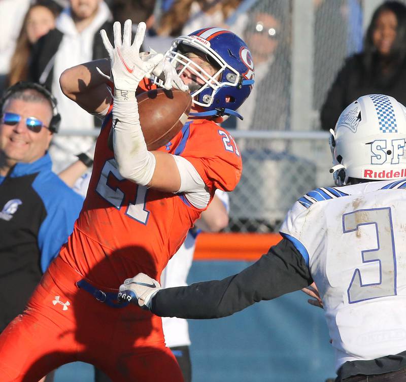 Genoa-Kingston's Jake Oates intercepts a pass in front of St. Francis' Ryan Calcagno Saturday, Nov. 6, 2021, during their IHSA Class 4A playoff game at Genoa-Kingston High School.