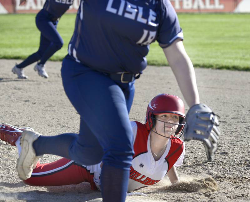 Streator’s Isabel Gutierrez dives back into first base ahead of a pickoff throw Tuesday, May 6, 2025, at the SHS Athletic Fields in Streator.