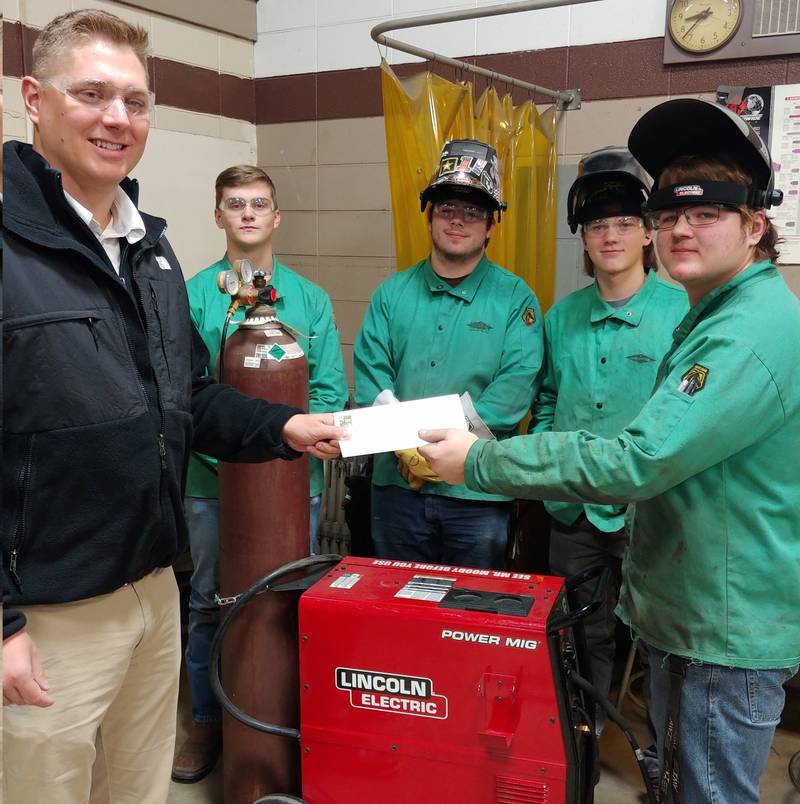 A fall 2022 grant check being donated to Sandwich's Indian Valley Vocational Center to support new welding equipment.