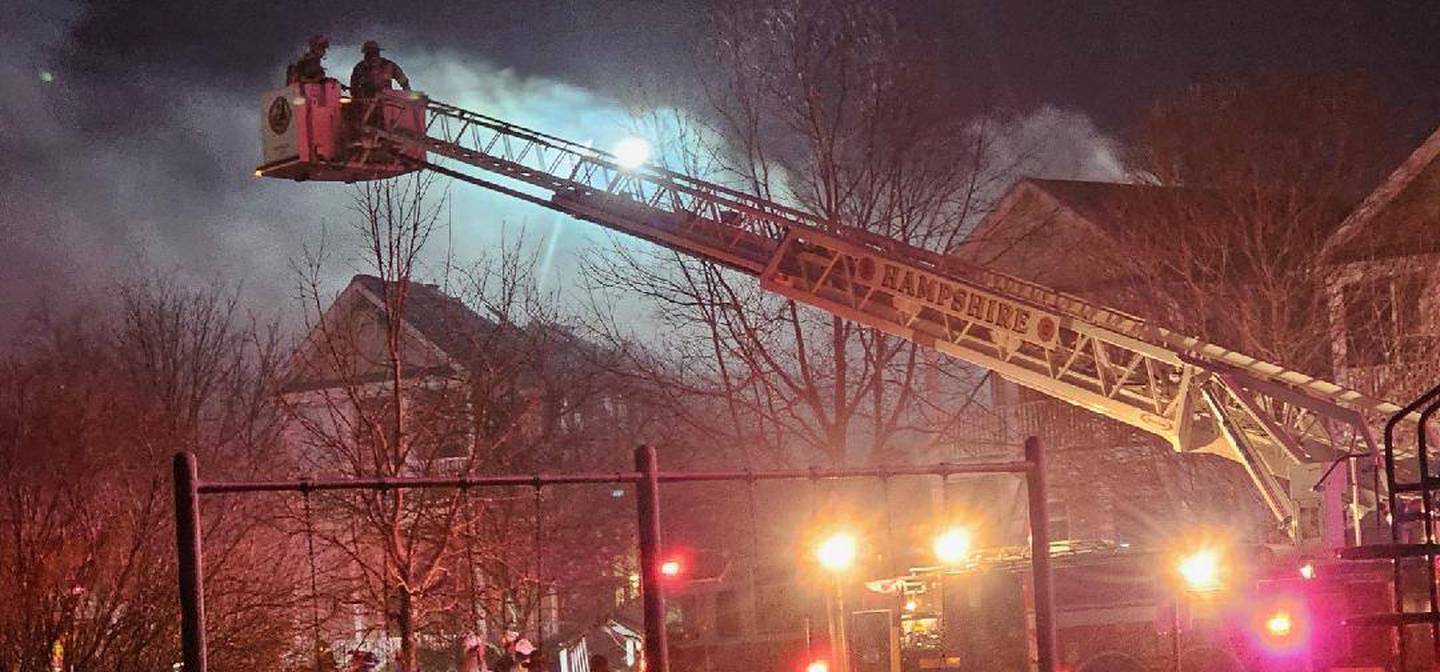 Crews battle a multi-home fire in the early morning hours on Sunday, March 16, 2025, in the 200 block of Market Street in the Riverbend Subdivision in Genoa.