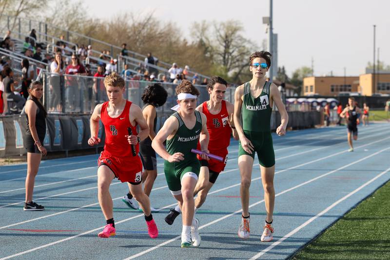 Bishop McNamara's Jack Purcell accelerates after a hand-off in the boys 4x800 relay during the All-City meet at Kankakee High School on Monday, April, 28, 2025. Bishop McNamara would take first ahead of Bradley-Bourbonnais in second and Kankakee in third.