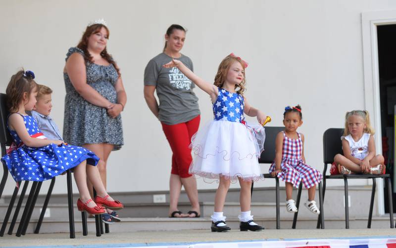 Esther Skoumal, 6, dances in the talent portion of Let Freedom Ring's Little Miss and Mister Firecracker contest on Wednesday, July 2, 2025. Watching (left to right) are Lucy Skoumal, Harrison Taylor, Zuraya Ritt, and Aniyah Eggleston. Also pictured are contest officials Heidi Nicholson and Abi Fletcher, the 2024 Let Freedom Ring Queen.