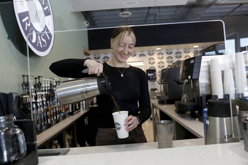 Courtney Valdes makes a coffee drink for a patron on Thursday, March 28, 2024, at Toast and Roast in McHenry. The recently opened coffee shop is part of the McHenry County Coffee and Tea Trail.