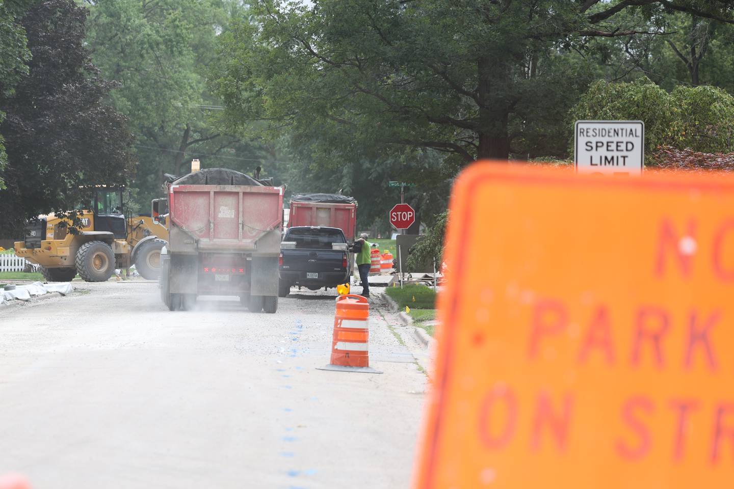 Construction workers take over White Avenue while working on water lines in Joliet. Thursday, August 4, 2022 in Joliet.