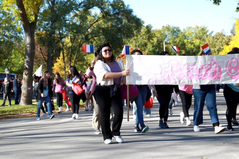 Members of the Downers Grove South French Club march in the school’s annual homecoming parade on Friday, Oct. 20, 2023.