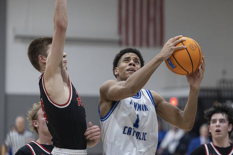 Newman’s Tyson Williams works below the basket against Hall Tuesday, Feb. 17, 2026.