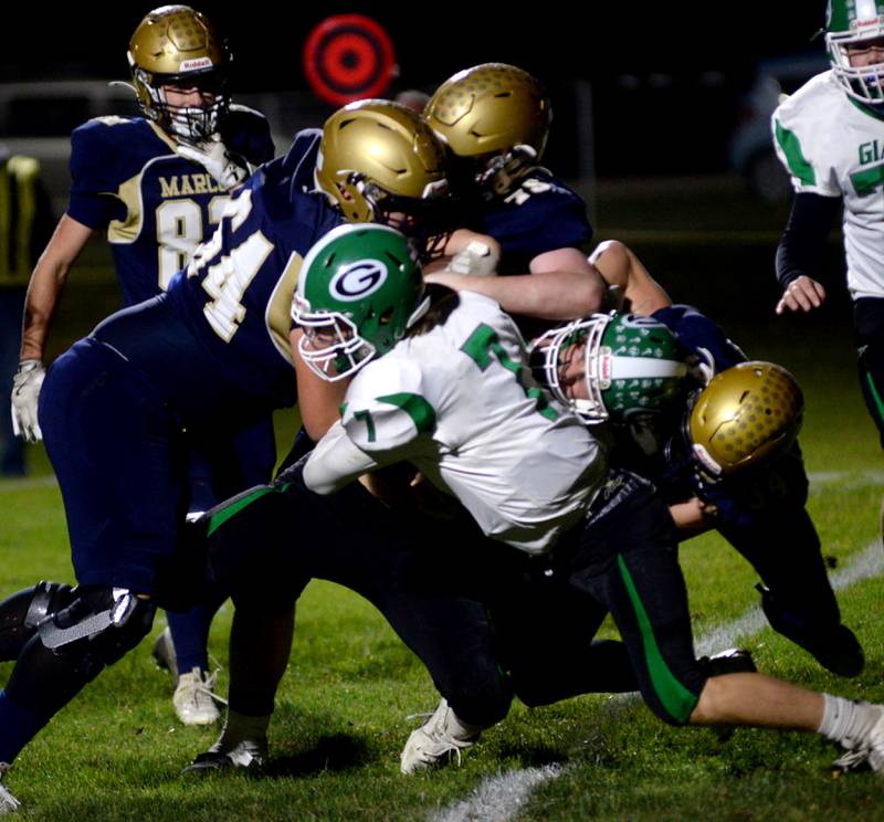 Marco defenders contain an Alden-Hebron player during 8-man playoff action on Friday, Nov. 1, 2024 in Polo.