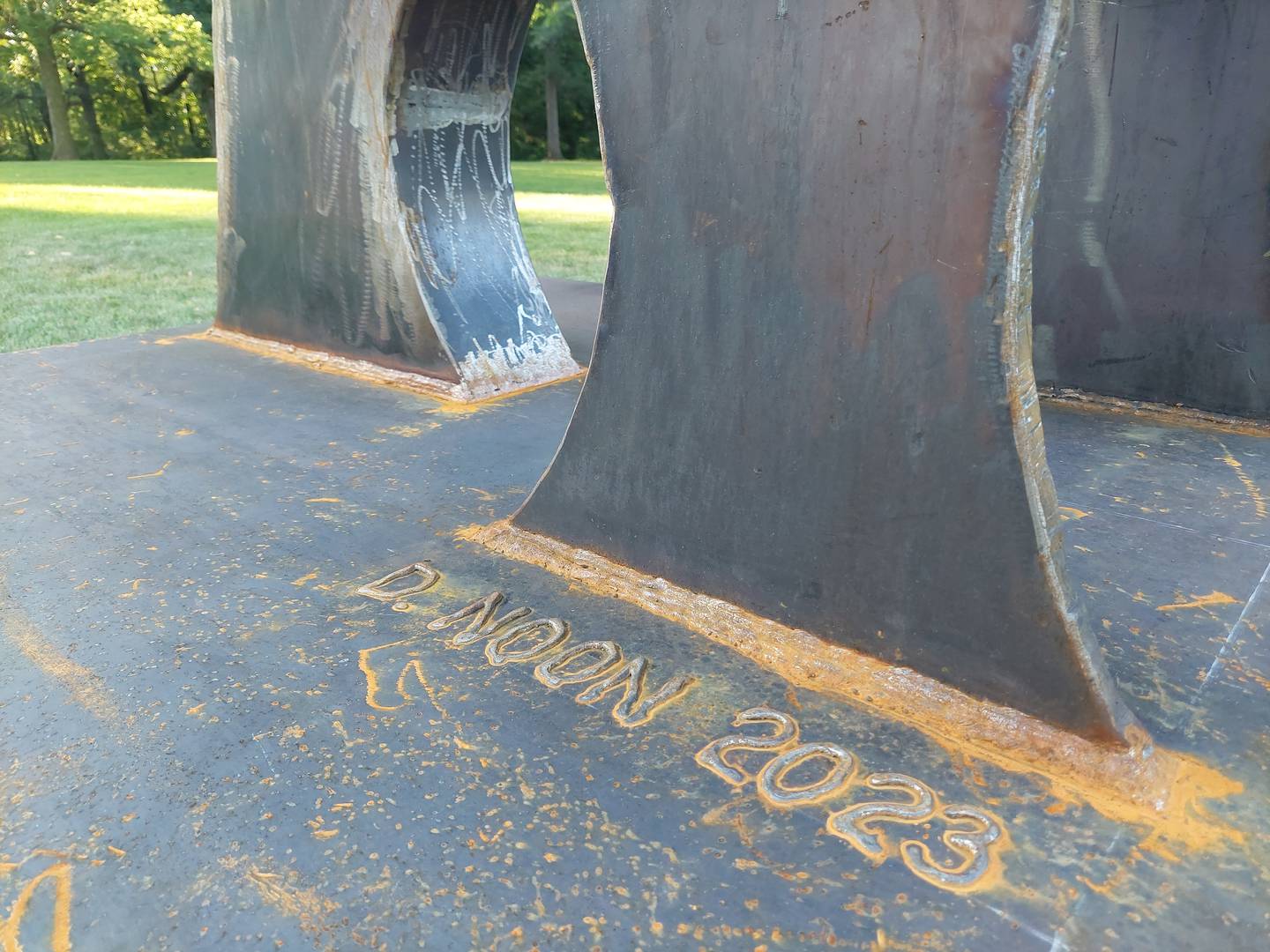 Don Noon's signature is on his latest sculpture placed at Marilla Park in Streator.