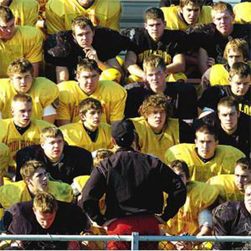 The Batavia football team listens to coach Mike Gaspari during the final moments of the last practice Friday in Batavia. The team will play against Normal Community High School today in the IHSA Class 6A state championship.