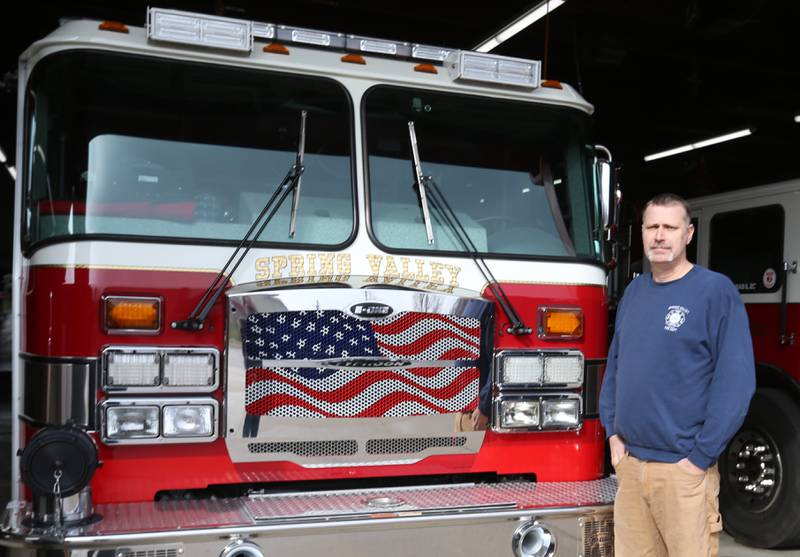 Spring Valley fire chief Todd Bogatitus poses for. a photo by a fire truck on Thursday, March 14, 2024 at the Spring Valley Fire Station.