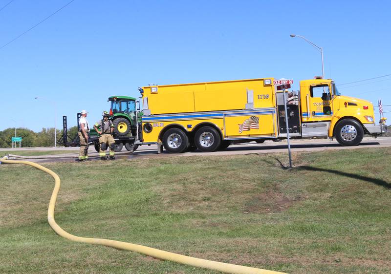 Tonica firefighters fill their tanker gruck from a fire hydrant at the corner of Illinois Route 26 and Interstate 180 to fight a structure at Marquis Energy on Wednesday, Oct. 8, 2025 in Hennepin. The fire was upgraded to a 5th alarm dispatching the (MABAS) Mutual Aid Box Alarm System. The fire broke out around 11a.m.