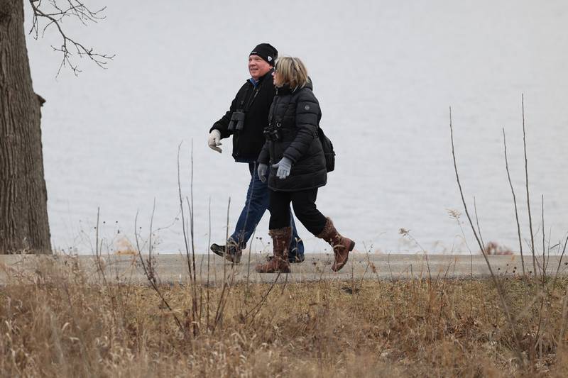 A couple finds a path away from the large crowds at the Four Rivers Environmental Education Center’s annual Eagle Watch program in Channahon.