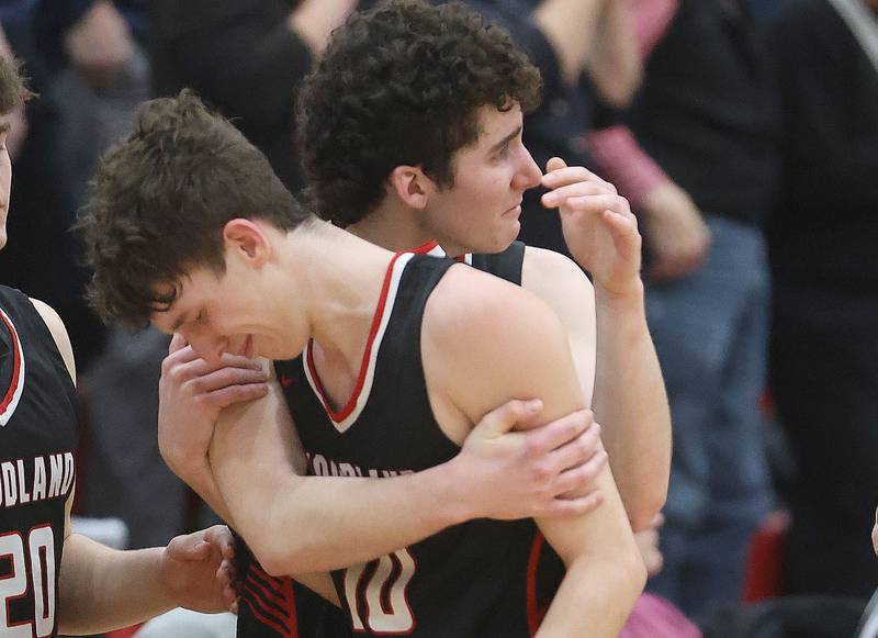 Woodland's Jaron Follmer hugs teammate Brezdyn Simons after loosing to Indian Creek during the Class 1A Sectional Semifinal game on Wednesday, March 4, 2026 at Amboy High School.