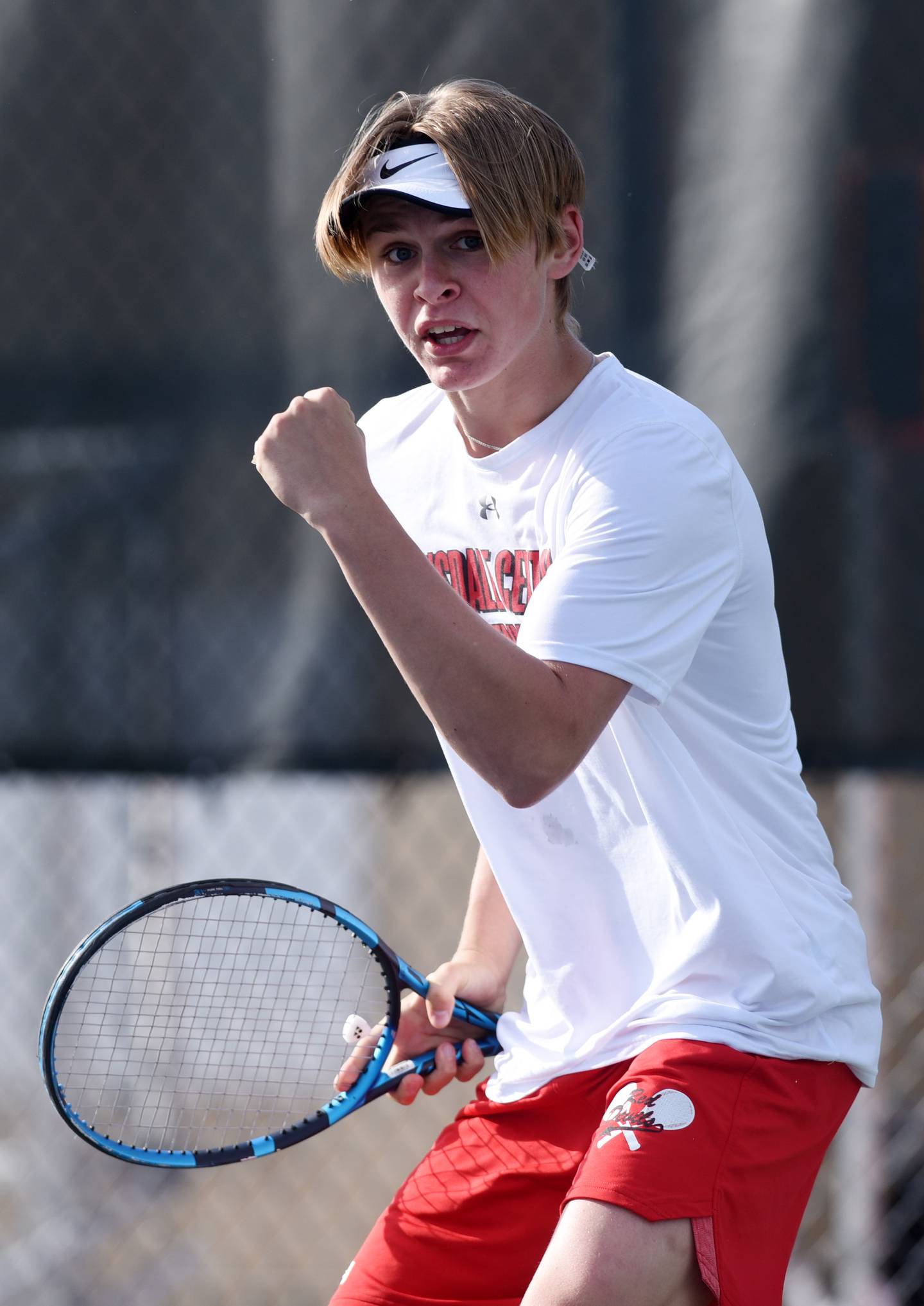 Hinsdale Central doubles player James Theriault celebrates a point during the Class 2A state tennis semifinals at Hersey High School in Arlington Heights Saturday.
