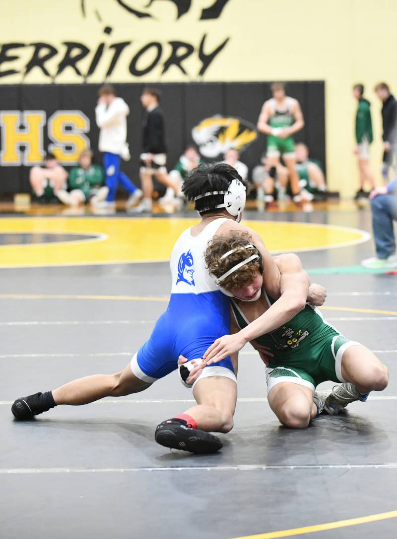 Coal City's Brody Widlowski wrestles Peotone's John Meneses during his 138-pound match victory on Saturday, Feb. 8, 2025, in the IHSA Class 1A Herscher regional.