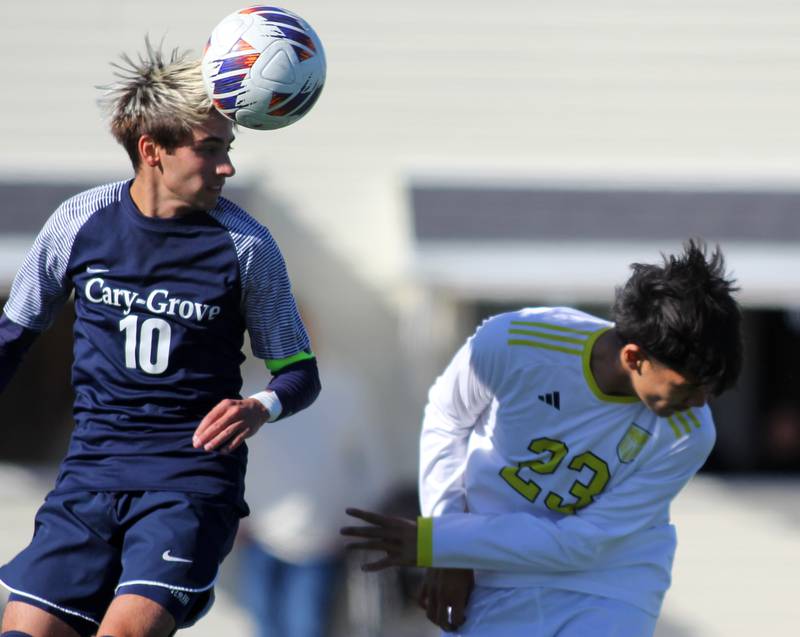 Cary-Grove’s Cole Waddell, left, battles Harvard’s Eric Valdez for the ball in IHSA Class 2A Regional Title Game soccer action on Saturday, Oct. 26, 2024, at  Harvard Junior High School  in Harvard.