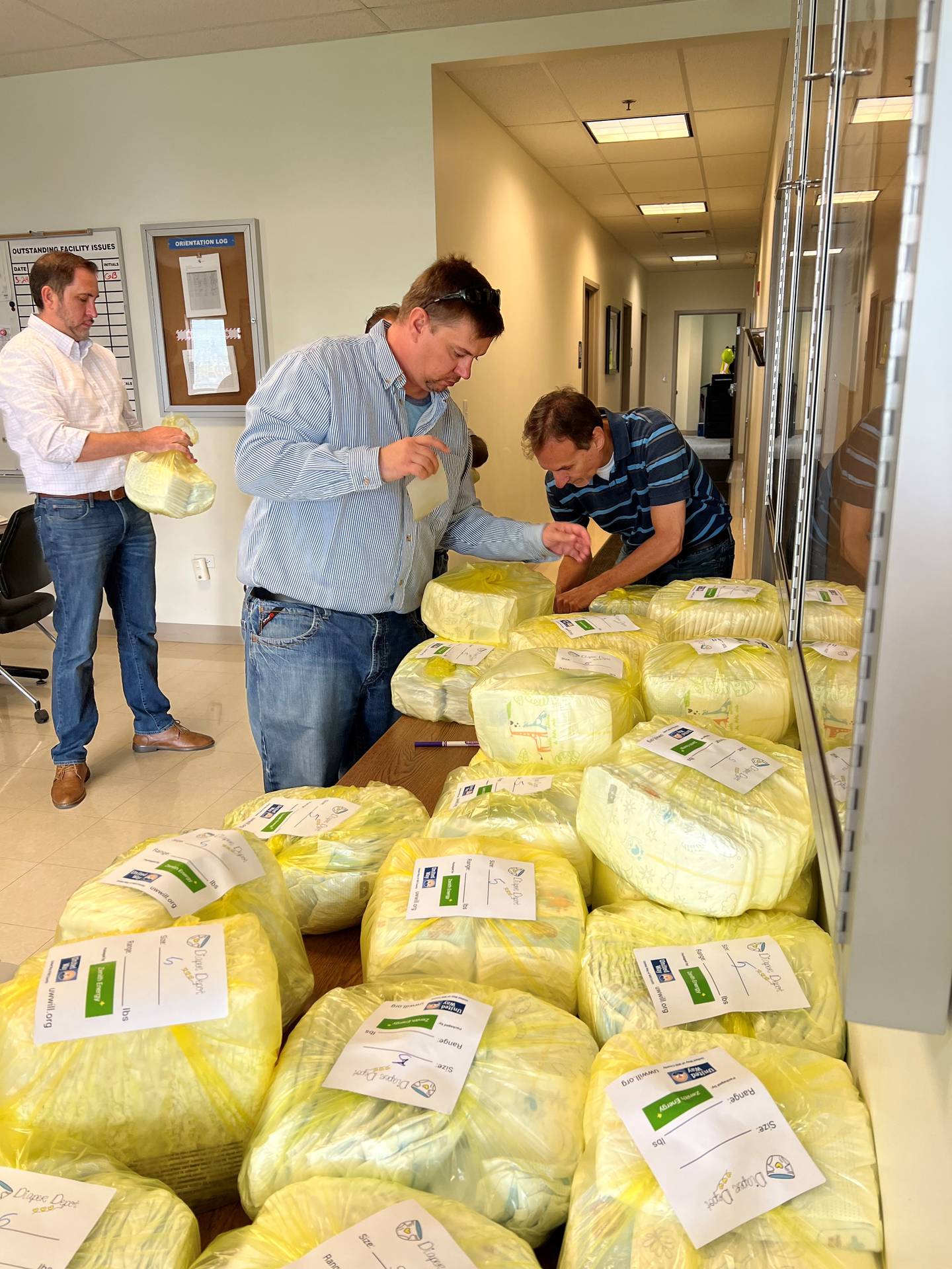 Zenith employees bundle diapers for a United Way of Will County Diaper Depot at a volunteer event in September 2022.
