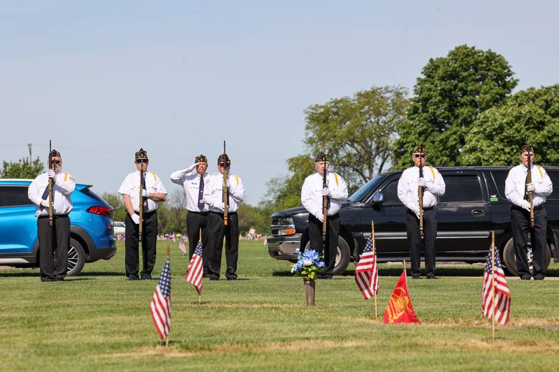 The St. George American Legion Post 1164 stands by for a rifle salute during a ceremony dedicated to the late John Kirnbauer, a veteran whose ashes went unclaimed for five years, on Monday, May 26, 2025, at Kankakee Memorial Gardens.