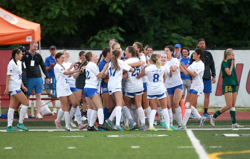 St. Charles North players celebrate their win over Fremd in the Class 3A state semifinal game at North Central College in Naperville on Friday, May 31, 2024.