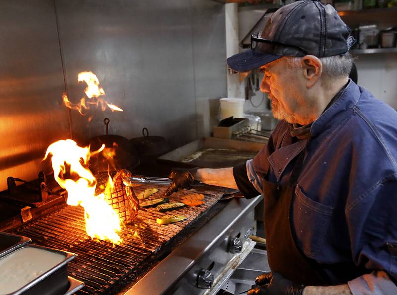 Executive chef Micheal Borlek grills a bone-in-ribeye steak on Tuesday, Jan. 14, 2025, at Addison’s Steakhouse, 335 Front St,,in McHenry,  The restaurant will be moving into the McHenry Country Club in March..