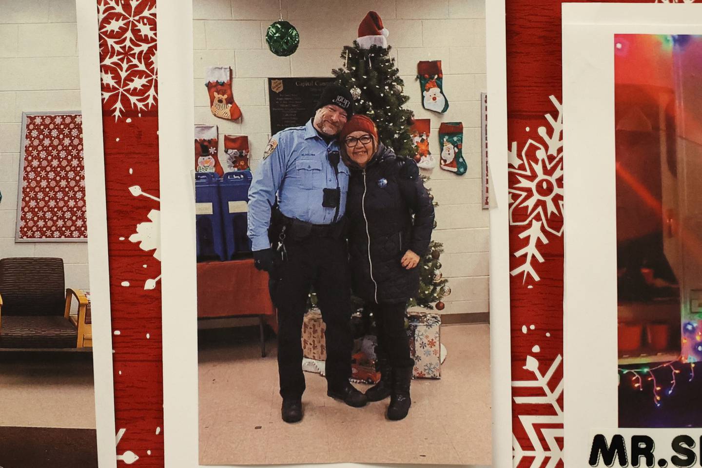 A photo of Officer Bob Klancher and Salvation Army Volunteer Coordinator Linda Trevino hangs in the lobby at the Salvation Army in Joliet. Officer Klancher is a regular volunteer at the Joliet location.