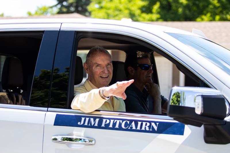 New Lenox Loyalty Day Parade Grand Marshal, Jim Pitcairn, waves to spectators on Cedar Rd. on May 5, 2024. (Laurie Fanelli for Shaw Local News Network)