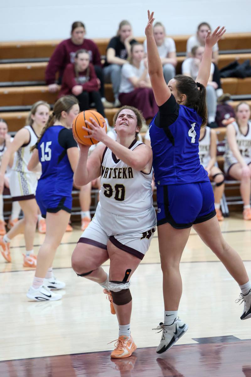Watseka-Milford's Taylor Chattic goes for a layup under pressure from Clifton Central's Kaitlyn Balthazor during the Warriors' 60-49 victory over Clifton Central on Saturday, Jan. 10, 2026.