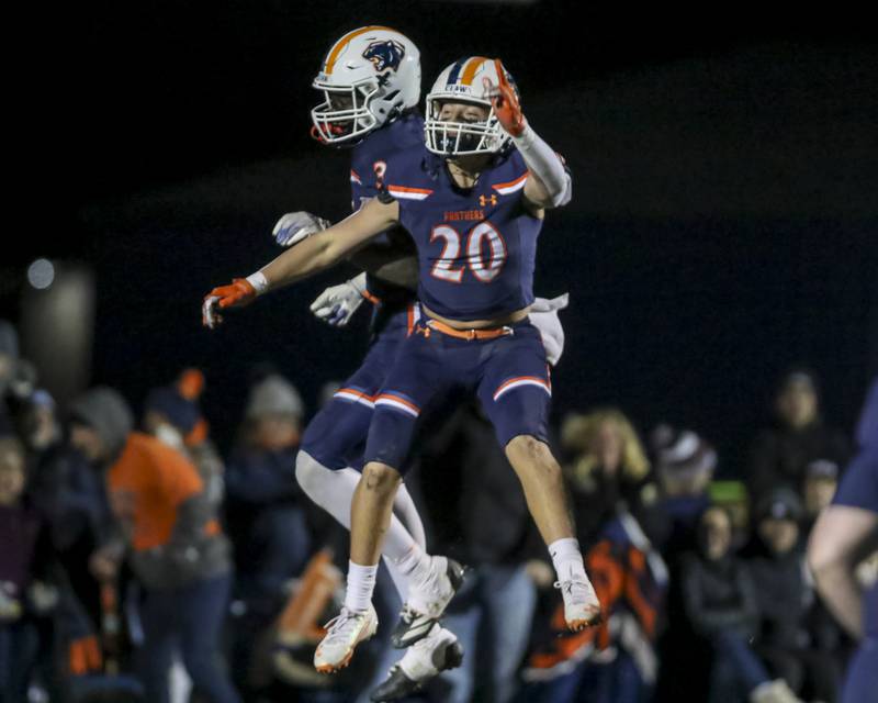 Oswego's Luke Hernandez (20) celebrates with Oswego's Ammar Banire (34) after Banire's long touchdown run during Class 8A semifinal football game between Lockport at Oswego. Saturday, Nov 22, 2025 in Oswego.