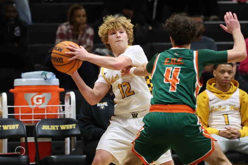 Joliet West’s Trooper Price looks for a play against Plainfield East on Friday, Dec. 19, 2025 in Joliet.