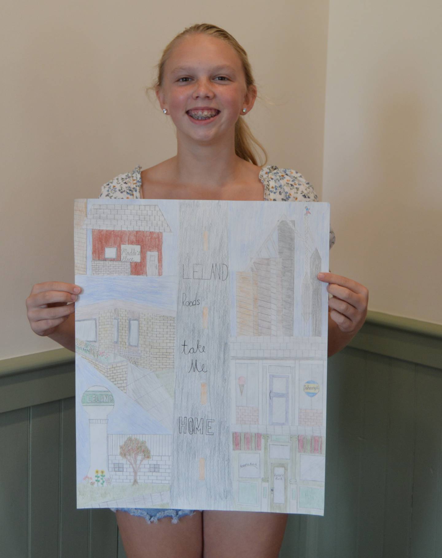 Macey Kinney, eight grader of Leland Middle School, displays her winning entry.