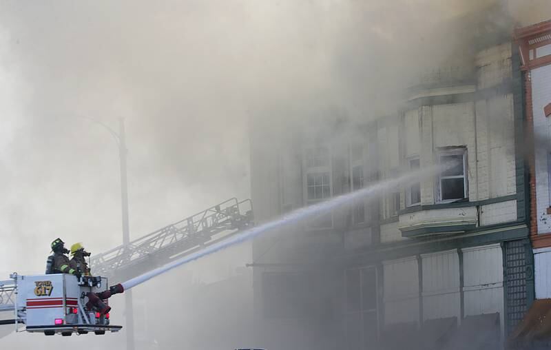 Mendota firefighters extinguish flames the apartment fire that occurred in the 800 block of Main Street in Mendota on Monday, Aug. 22, 2022.