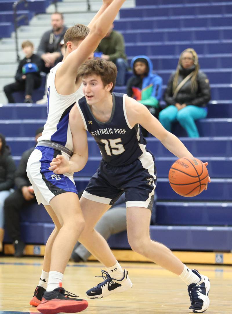 ICCP's Kal Kilgast (15) tries to get around the defense during the boys varsity basketball game between IC Catholic Prep and Riverside Brookfield in Riverside on Tuesday, Jan. 24, 2023.