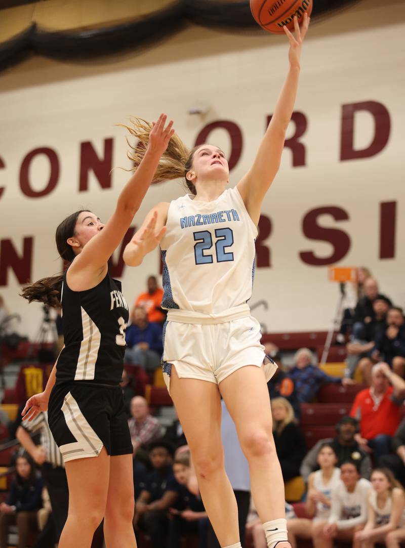 Nazareth's Gracie Carstensen (22) lays up a shot during the girls 3A varsity super-sectional game between Nazareth Academy and Fenwick High School in River Forest on Monday, Feb. 27, 2023.