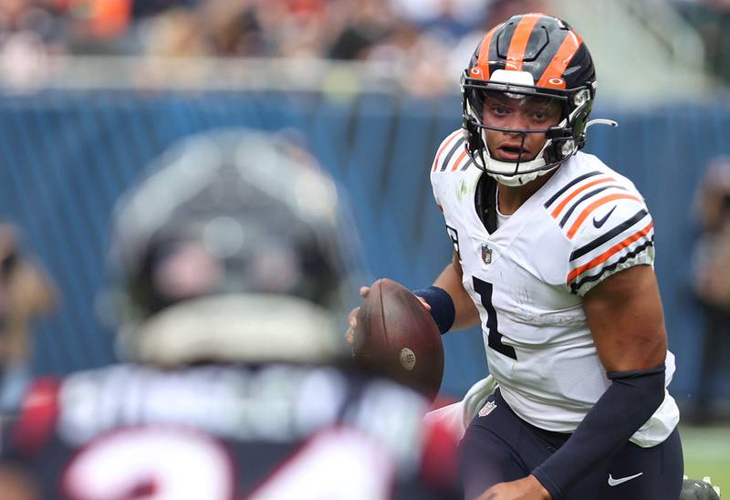 Chicago Bears quarterback Justin Fields looks to get past Houston Texans cornerback Derek Stingley Jr. as he scrambles during their game Sunday, Sept. 25, 2022, at Soldier Field in Chicago.