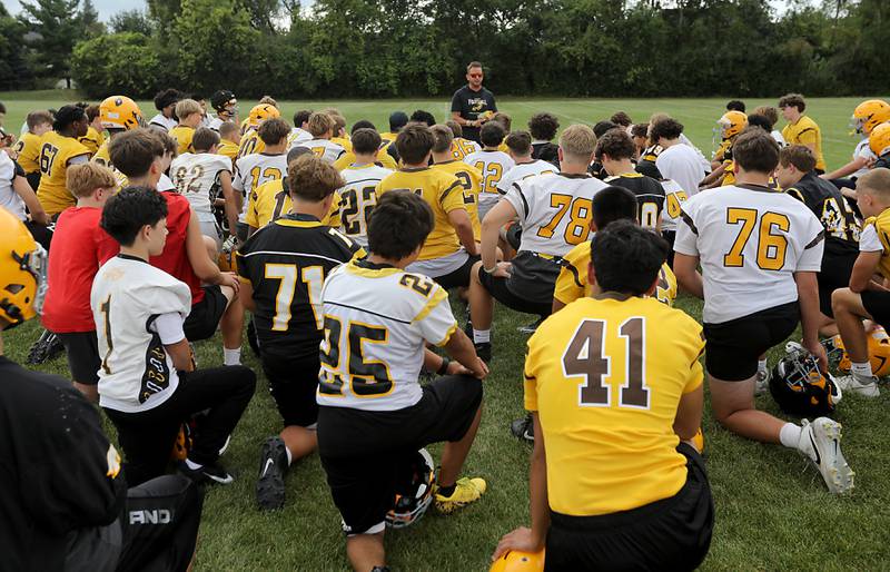Jacobs Head Coach Brian Zimmerman.talks to his team before the start of football practice on Tuesday, August 15, 2025, at Jacobs High School in Algonquin.